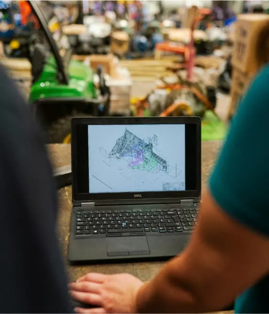 A person sitting in the front of a laptop